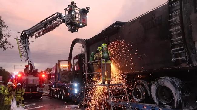 Fire crews are working to confirm the cause of a dramatic garbage truck fire on the M7 Motorway at Horsley Park on January 21.