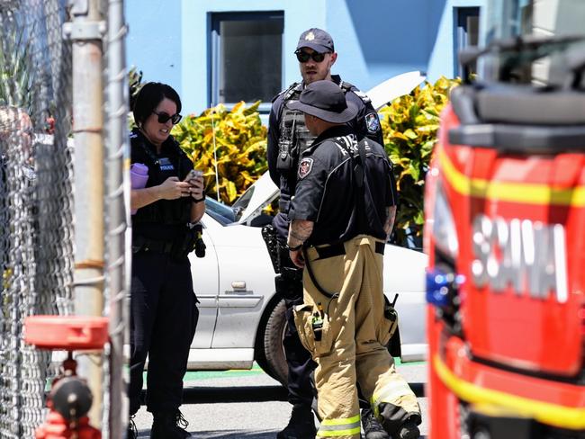 Queensland Police and Queensland Fire Department officers respond to an emergency at the General Aviation area of the Cairns Airport, where a man suffered life threatening injuries after being crushed by a car in the carpark of Hinterland Aviation. Picture: Brendan Radke