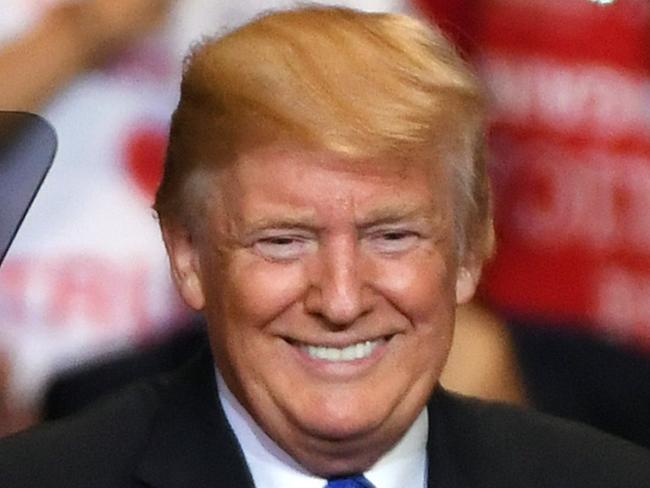 LAS VEGAS, NV - SEPTEMBER 20: U.S. President Donald Trump smiles as he walks onstage for a campaign rally at the Las Vegas Convention Center on September 20, 2018 in Las Vegas, Nevada. Trump is in town to support the re-election campaign for U.S. Sen. Dean Heller (R-NV) as well as Nevada Attorney General and Republican gubernatorial candidate Adam Laxalt and candidate for Nevada's 3rd House District Danny Tarkanian and 4th House District Cresent Hardy.   Ethan Miller/Getty Images/AFP == FOR NEWSPAPERS, INTERNET, TELCOS & TELEVISION USE ONLY ==