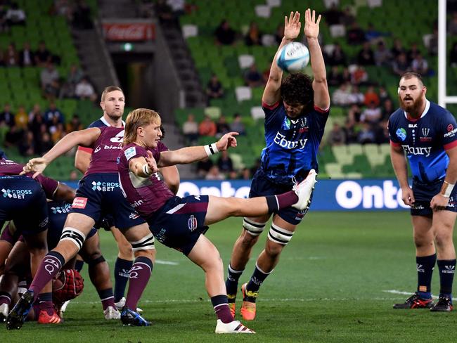 Reds skipper Tate McDermott gets a kick away during his side’s win over the Rebels. Pictuie: William WEST / AFP