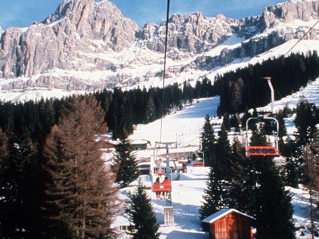 Italian ski resort, Val Gardena, in the Dolomites, part of the Italian Alps. It is easier to take the ski lift than run up the mountains.