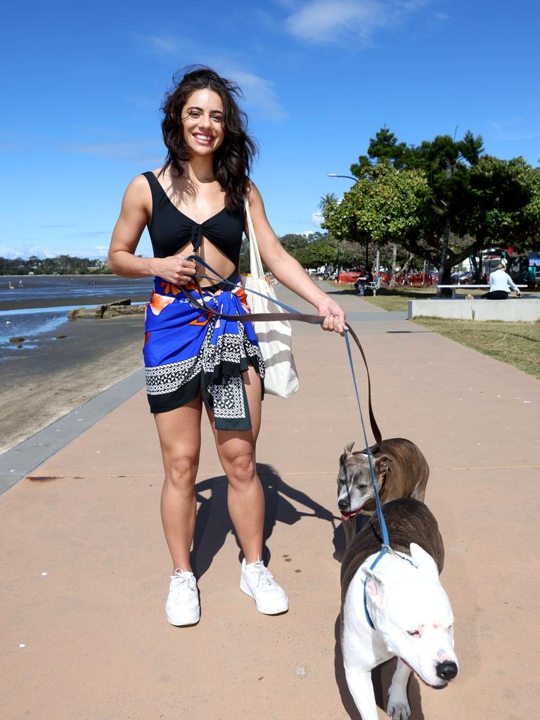 Betty Harrison with pups Sapphira and Kelsey, from Fortitude Valley at Sandgate Beach. Picture: Steve Pohlner