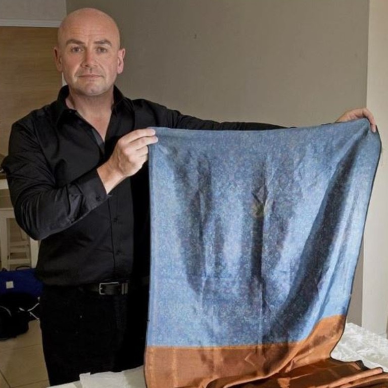 Russell Edwards pictured with the shawl connected to the Jack the Ripper case. Picture: Instagram / Russell Edwards