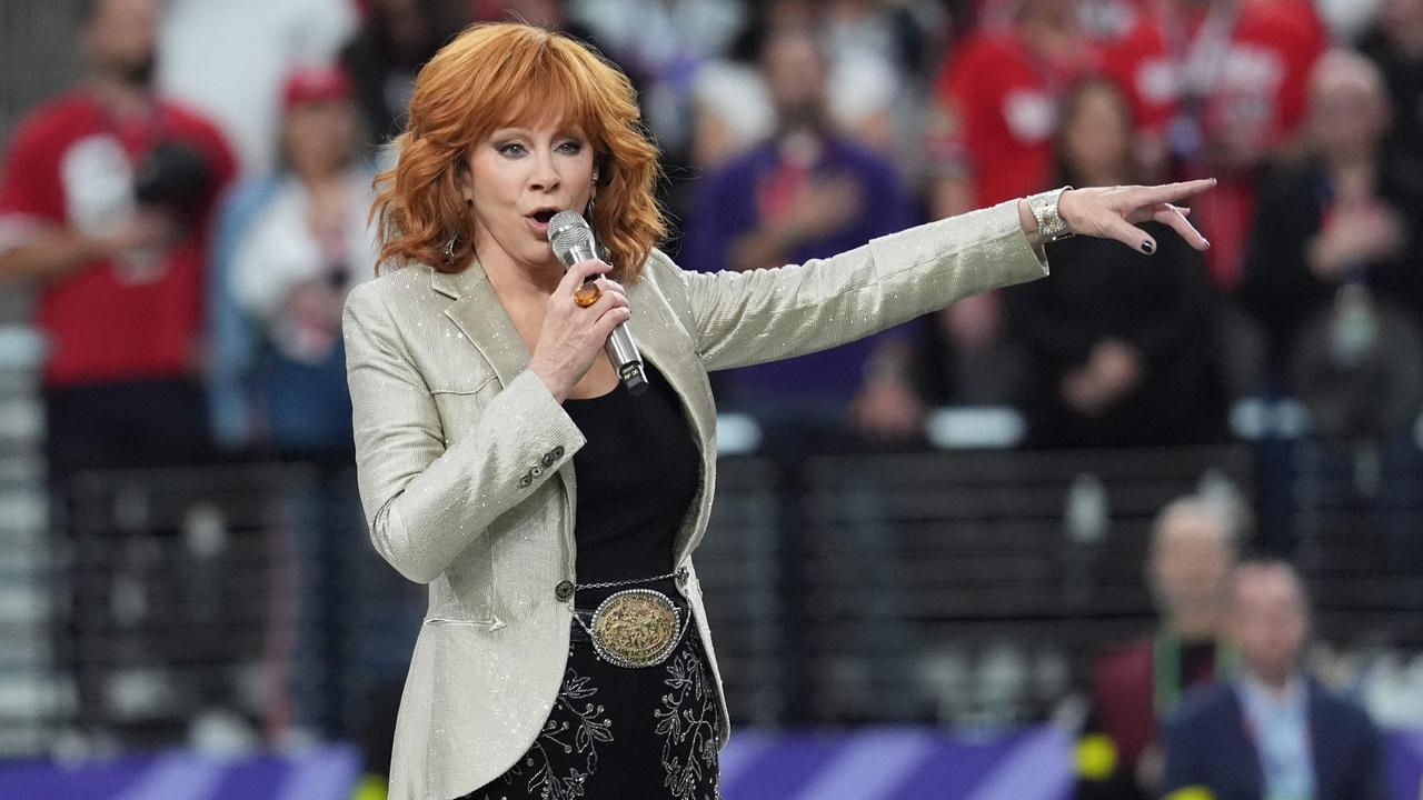 US singer Reba McEntire sings the National Anthem ahead of Super Bowl LVIII between the Kansas City Chiefs and the San Francisco 49ers at Allegiant Stadium in Las Vegas, Nevada, February 11, 2024. (Photo by TIMOTHY A. CLARY / AFP)