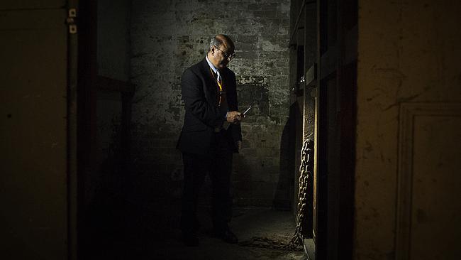 Tony Eid, Director of Operations for Sydney Trains, stands in a disused jail cell under Central Station beside chains used to shackle prisoners. Photos: Chris McKeen