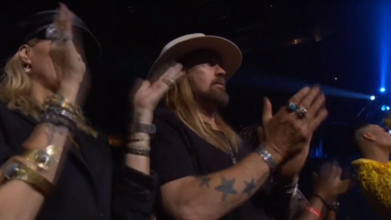 Proud dad Billy Ray.