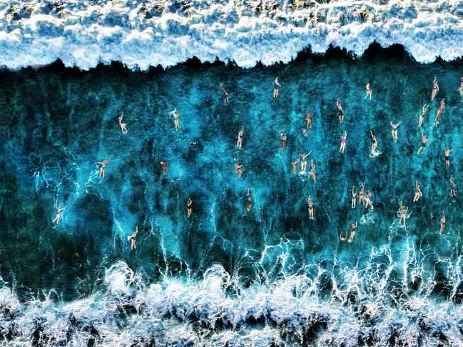 Roberto Corinaldesi’s entry into the 2020 Sony World Photography Awards, which took home a place as Winner in the National Awards. It is of swimmers seen from above take on the appearance of human ants. Picture: Roberto Corinaldesi, Italy/2020 Sony World Photography Awards