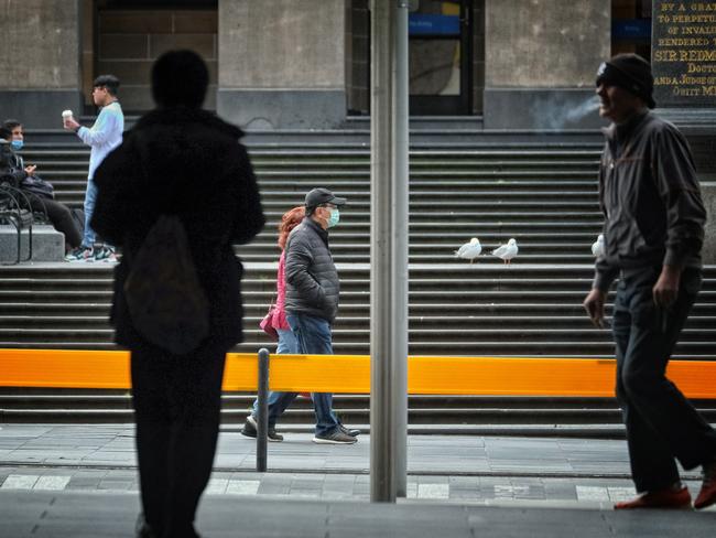 People in Melbourne's deserted CBD., Picture: NCA NewsWire / Luis Ascui