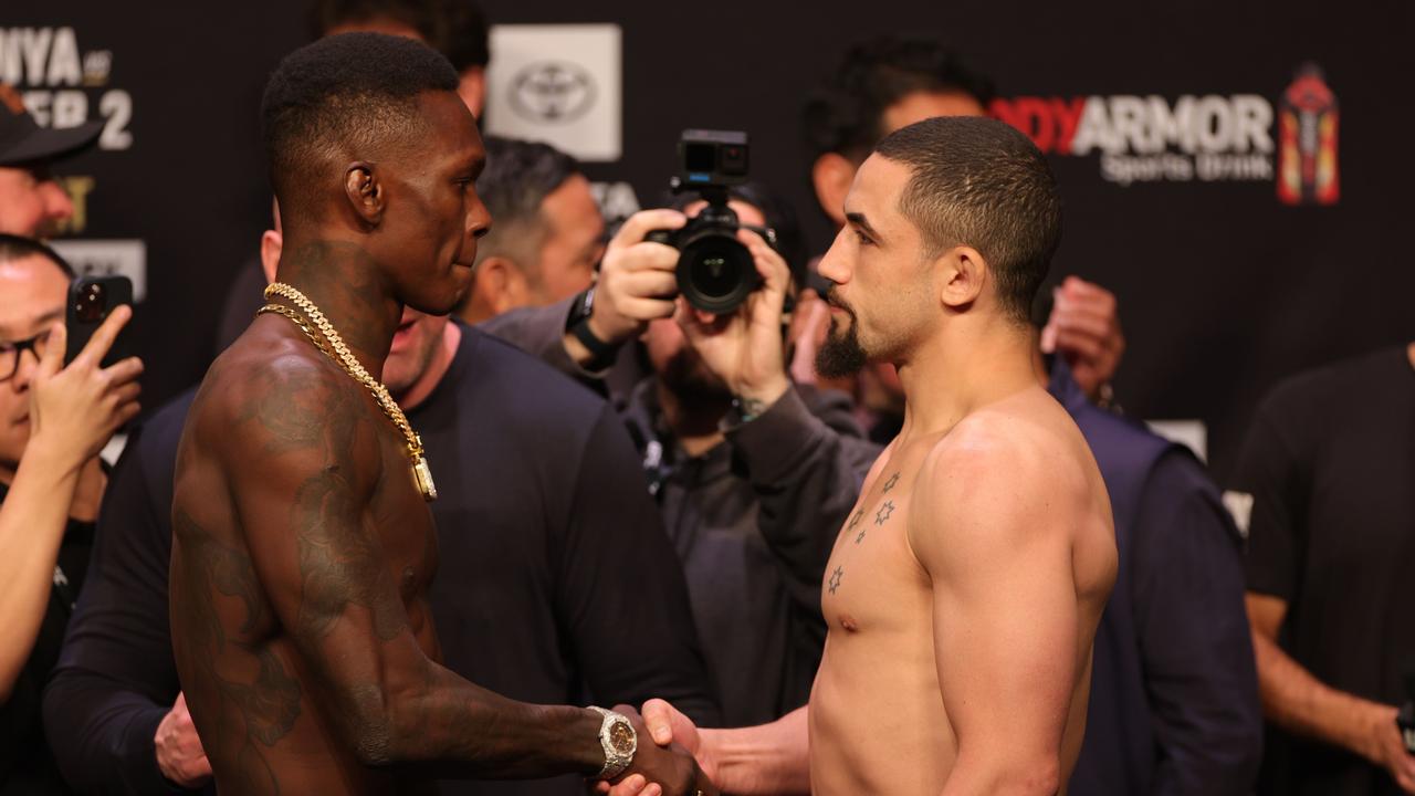 HOUSTON, TEXAS - FEBRUARY 11: Israel Adesanya of Nigeria faces off against Robert Whittaker of Australia at the ceremonial weigh in prior to UFC 271 at Toyota Center on February 11, 2022 in Houston, Texas. Carmen Mandato/Getty Images/AFP == FOR NEWSPAPERS, INTERNET, TELCOS &amp; TELEVISION USE ONLY ==