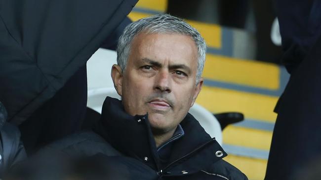 Manchester United's Portuguese manager Jose Mourinho (C).