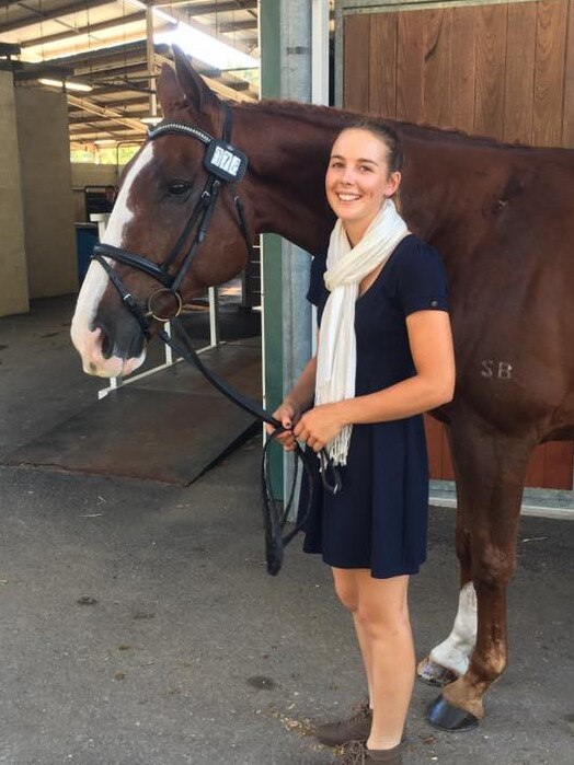 Caitlyn Fischer with her horse Ralphie.