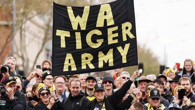 Tiger fans show their support during the AFL Grand Final Parade. Picture: AAP