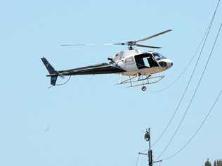 helicopter stringing new power lines along Tin Can Bay Rd Photo Craig Warhurst / The Gympie Times. Picture: Craig Warhurst