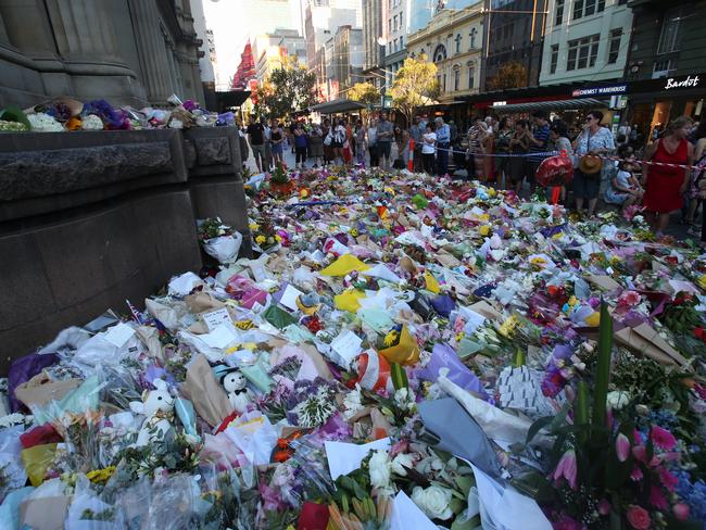 A flower memorial in Bourke St yesterday. Picture: David Crosling