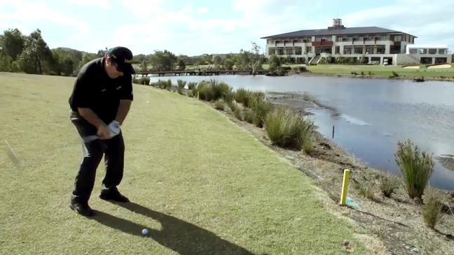 Craig Parry skims ball across water