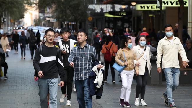 Shoppers in Sydney’s Pitt Street Mall. Consumption has been supported by government stimulus measures, but these are set to end. Picture: David Swift