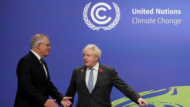 Britain's Prime Minister Boris Johnson greets Australia's Prime Minister Scott Morrison at the COP26 UN Climate Change Conference in Glasgow.
