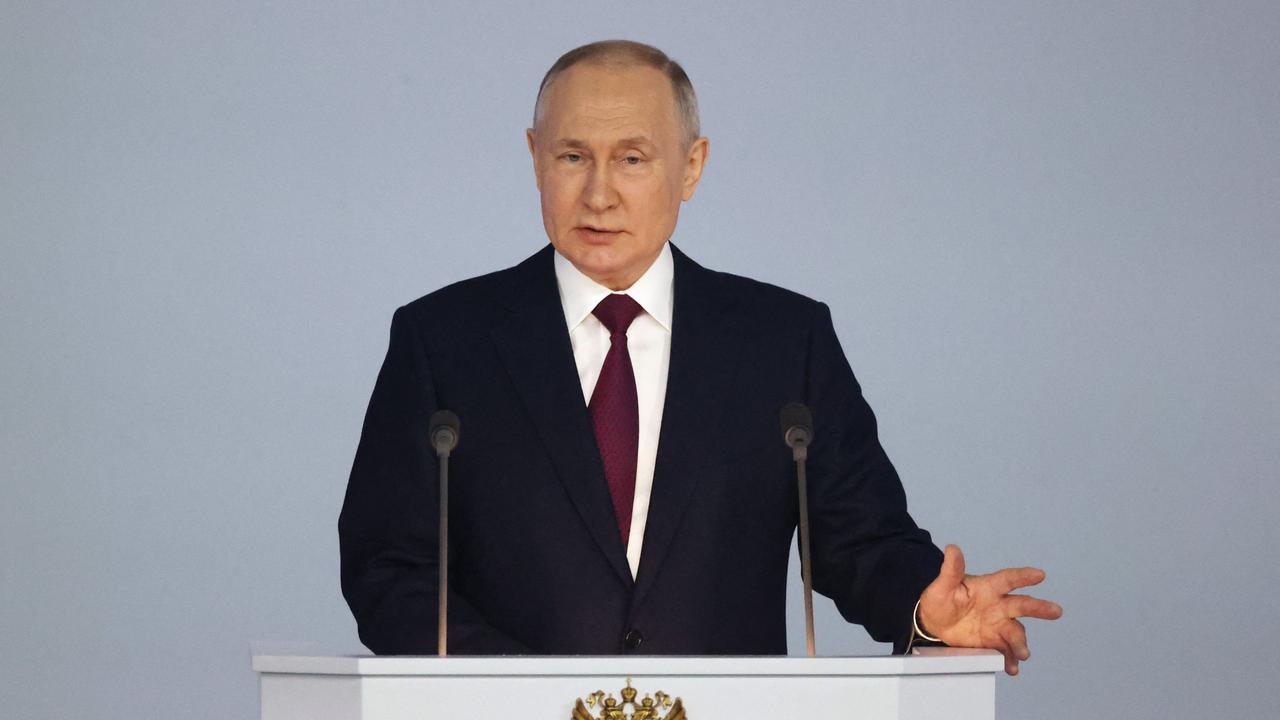 Russian President Vladimir Putin delivers his annual state of the nation address at the Gostiny Dvor conference centre in central Moscow. (Photo by Sergei KARPUKHIN / SPUTNIK / AFP)