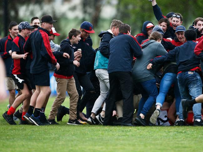 Spectators storm the field after the final siren to celebrate Flagstaff Hill’s first top-flight Southern Football League premiership. Picture: Matt Loxton.