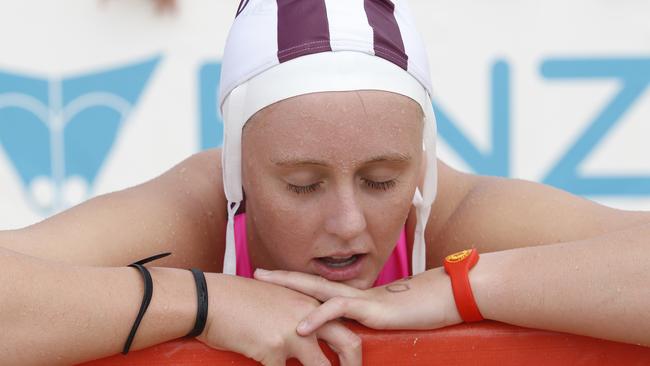 An exhausted Leah Pilkington of Queensland catches her breath after her seocnd in the youth ironwoman.