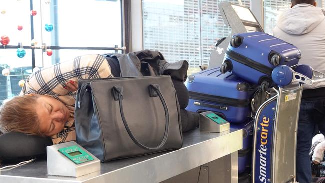 Travellers waits for flights at O'Hare International Airport on December 22 as flights are cancelled. Picture: Scott Olson/Getty Images/AFP.