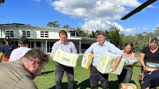 Dr Rowan (third from right) and Cr Greg Adermann (fourth from right) at a food drop they organised at Mt Crosby last week.