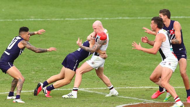 Zak Jones of the Saints handballs during the round 6 AFL match between the Fremantle Dockers