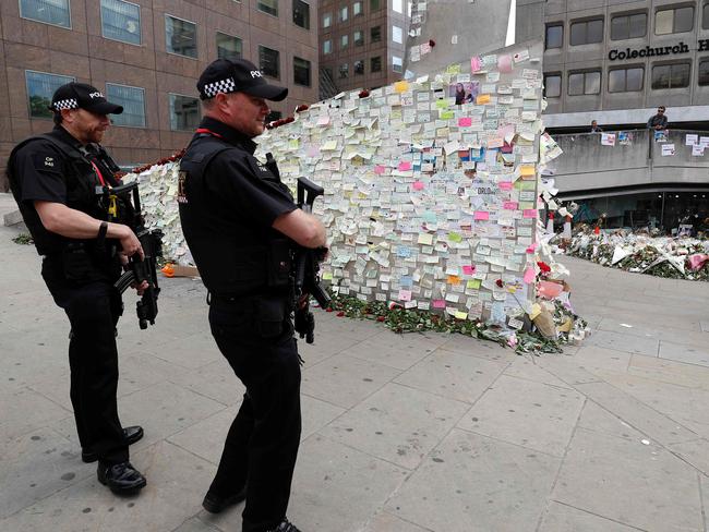 Armed police officersat a memorial for the London Bridge victims. Picture: AFP