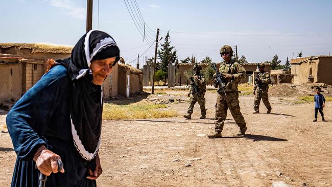 American soldiers patrol a village in the countryside of the Kurdish-majority city of Qamishli in Syria's northeastern Hasakeh province. Picture: AFP