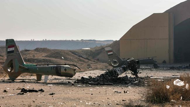 This picture shows a burned Syrian army helicopter after the Israeli military hit weapons depots near the Mazzeh military, outside Damascus, on December 9, 2024. Picture: AFP