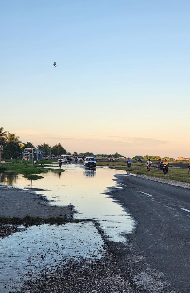 Residents of Tuvalu go about their business as rising sea levels complicates their day to day lives. Photo: James Lewis, Intercoastal Consulting