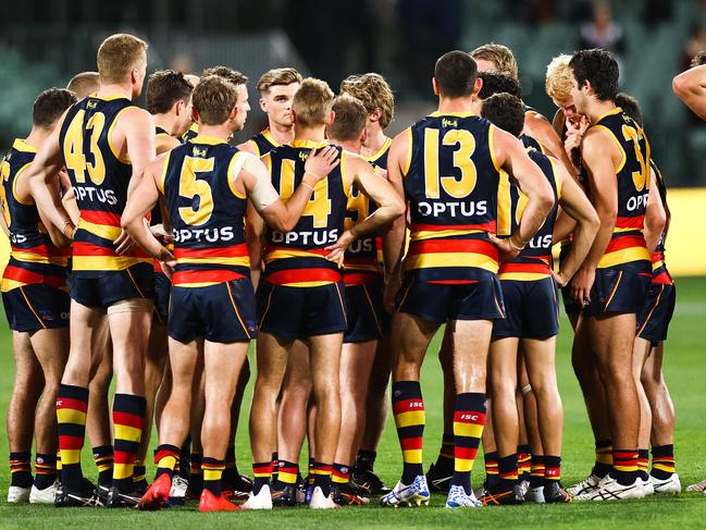 Winning formula: Adelaide Crows players gather after the final siren.