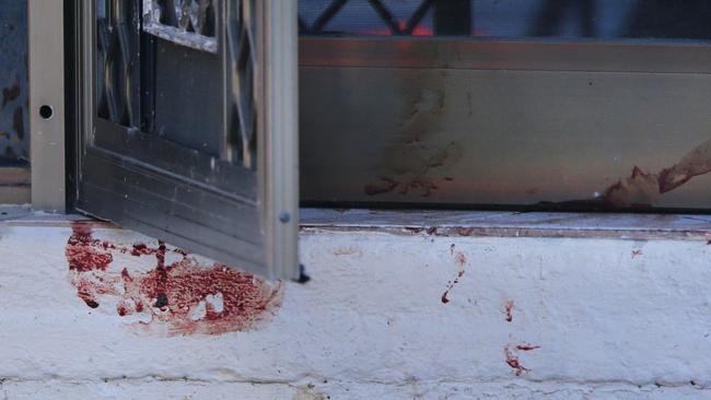 Blood on the front step of the woman’s home. Picture: Darren England