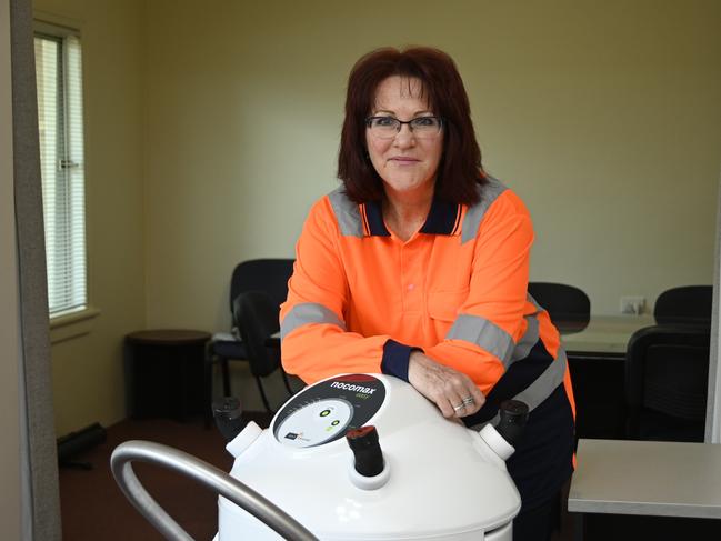 Sue White, Accounting & Administration Manager Ability Enterprises shows off their new cleaning machine that can disinfect areas of up to 20,000m3.