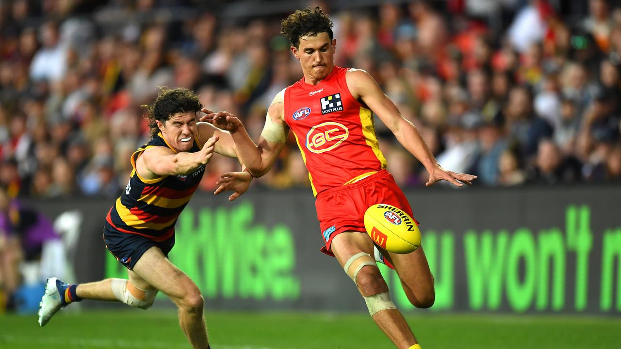 Suns defender Wil Powell kicks the ball forward before suffering an ankle injury. Picture: Albert Perez / Getty Images