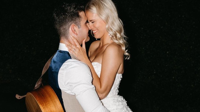 Hervey Bay wedding singer William Ramage, pictured here on his own wedding day to Hannah with his trusted guitar, has auditioned for Australian Idol. Photo: Facebook