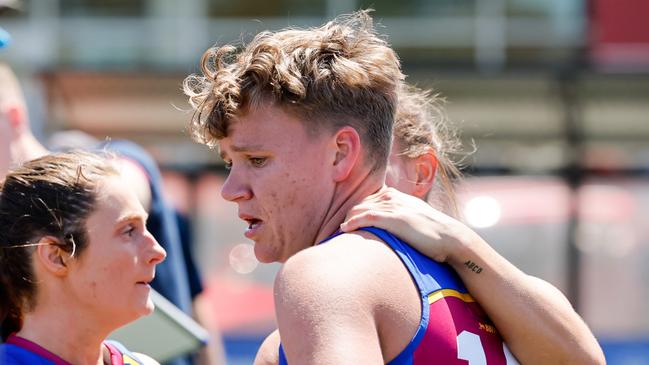 MELBOURNE, AUSTRALIA - NOVEMBER 03: Dakota Davidson of the Lions is seen being consoled by teammates at 3/4 time during the 2024 AFLW Round 10 match between Euro-Yroke (St Kilda Saints) and the Brisbane Lions at RSEA Park on November 03, 2024 in Melbourne, Australia. (Photo by Dylan Burns/AFL Photos via Getty Images)