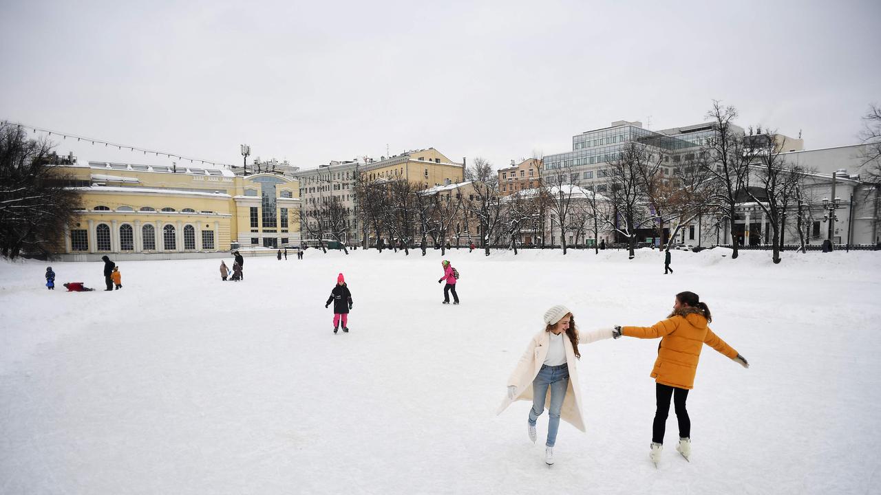 People skate on a frozen pond in downtown Moscow. Picture: Natalia Kolesnikova/AFP