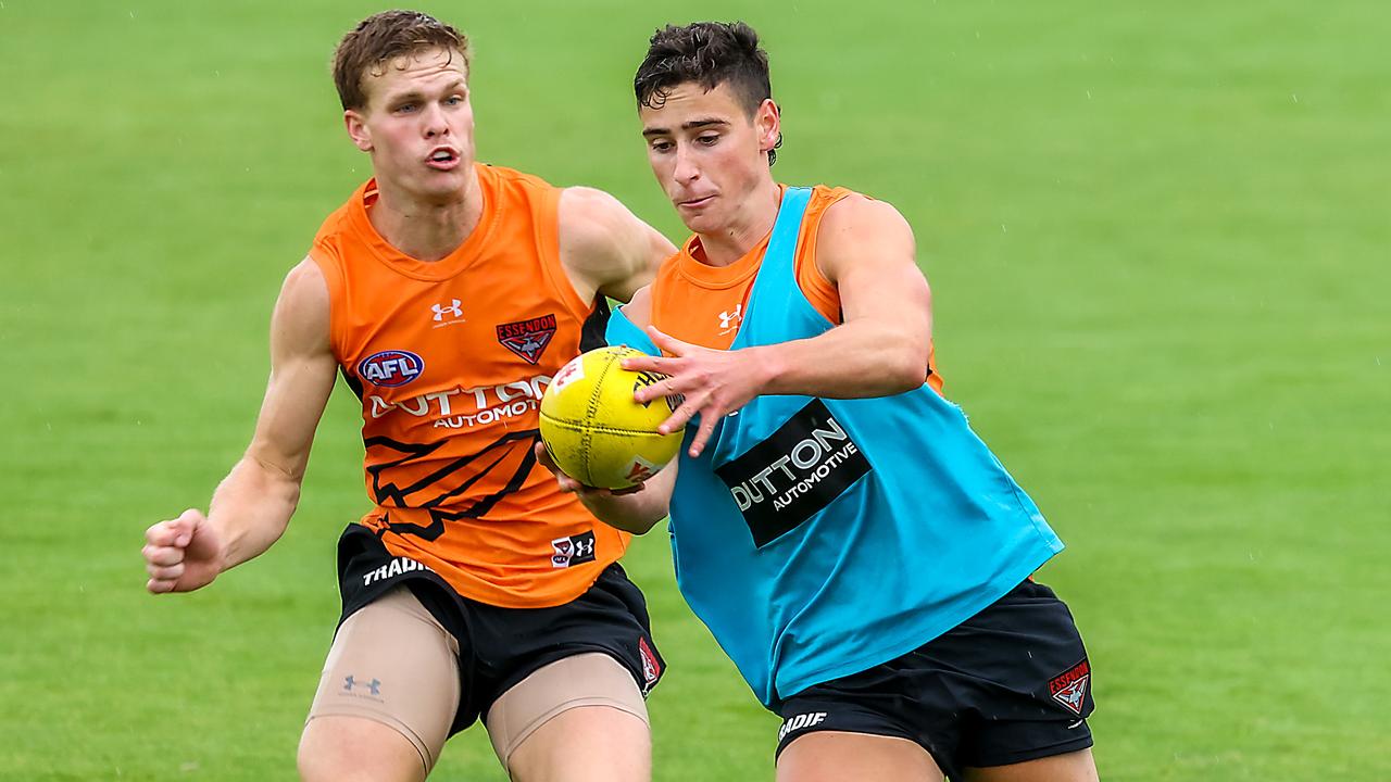 Young gun Elijah Tsatas with ball in hand during Essendon’s open training on Saturday. Picture: Ian Currie