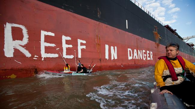 Greenpeace activists paint the message 