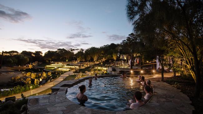 Bathing in the amphitheatre at twilight at the Peninsula Hot Springs.