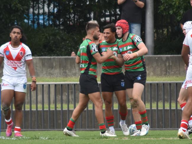 Yasin Kuscu (left) celebrates a Dayne Jennings (right) try. Picture: Sean Teuma