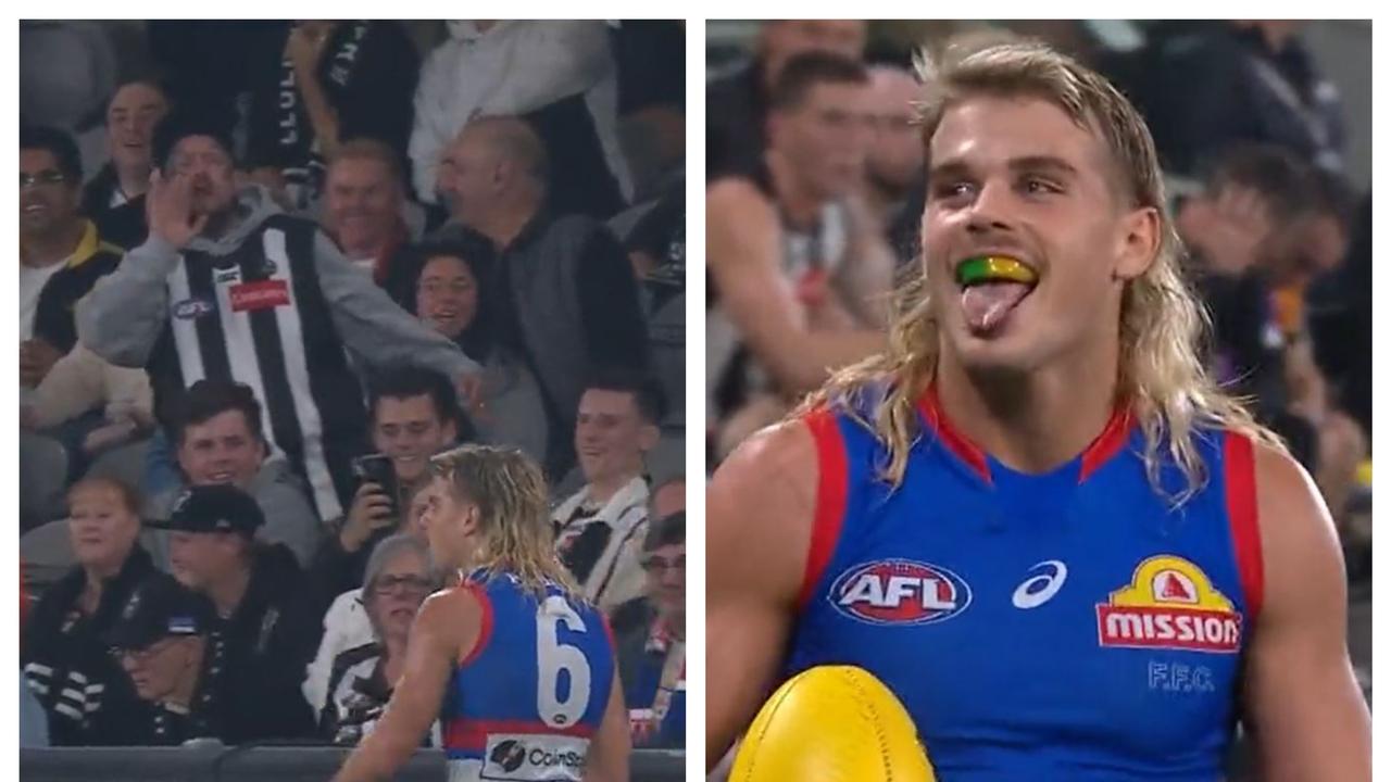 Bailey Smith engages with a a Pies fan.