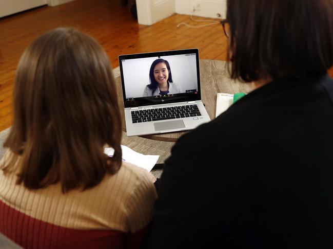 Joanne Gartside and her daughter Isobel Mandin take part in a video conference with Isobel’s teacher Joanna Nivison-Smith. Picture: Sam Ruttyn