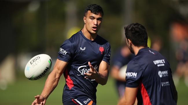 SYDNEY, AUSTRALIA – MARCH 29: Joseph Suaalii passes during a Sydney Roosters NRL training session at Kippax Lake on March 29, 2021 in Sydney, Australia. (Photo by Matt King/Getty Images)