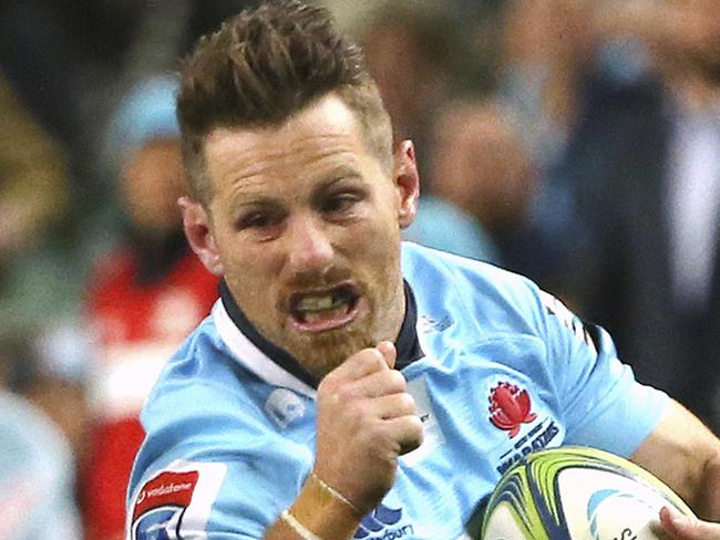 Waratahs' Bernard Foley, right, attempts to run past Highlanders' Lima Sopoaga during their Super Rugby quarterfinal match in Sydney, Saturday, July 21, 2018. (AP Photo/Rick Rycroft)