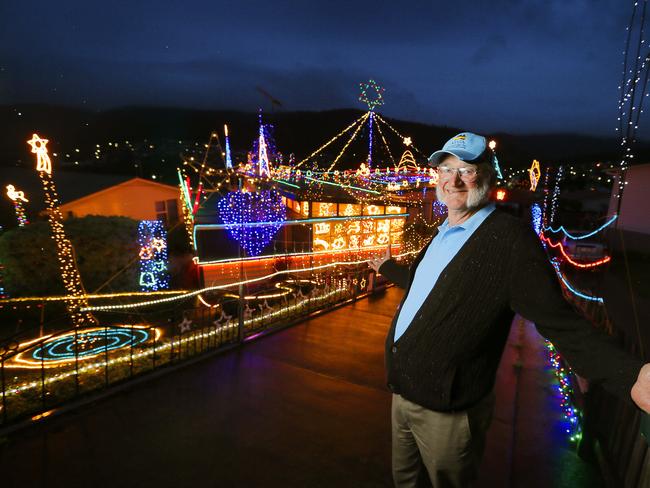 Malcolm Pearce, 74, with his massive Christmas lights display in Risdon Vale.