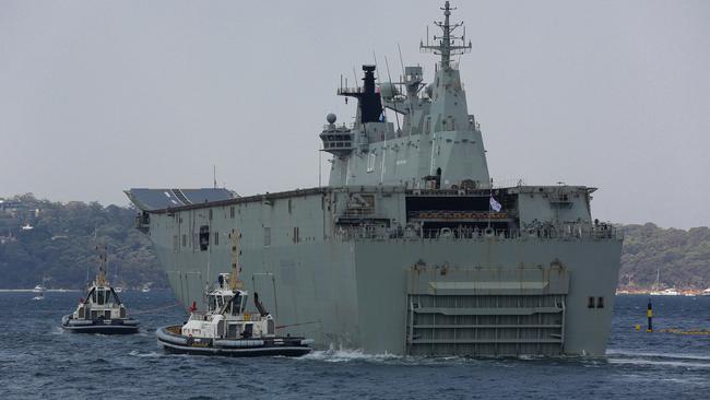 HMAS Adelaide loads supplies and departs Sydney, Garden Island in Sydney on January 04, 2020. Picture: Gaye Gerard