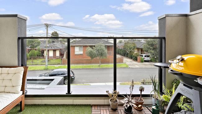 A balcony overlooking the street.