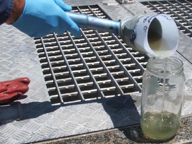 A sample of Clarence Valley sewage water is collected to be tested for COVID-19. Photo: Clarence Valley Council